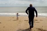 Image: grandfather and grandchild on beach